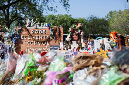 Privacy barriers and bike racks maintain a perimiter at a memorial outside Robb Elementary School, after a video was released showing the May shooting inside the school in Uvalde, Texas, U.S., July 13, 2022. Photo by Kaylee Greenlee Beal/REUTERS