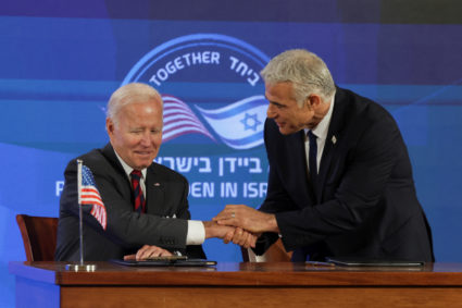 U.S. President Joe Biden and Israeli Prime Minister Yair Lapid attend the first virtual meeting of the "I2U2" group with leaders of India and the United Arab Emirates, in Jerusalem, July 14, 2022. Photo by Evelyn Hockstein/REUTERS