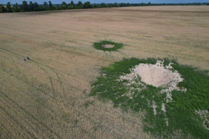 Shell craters are seen in a wheat field near the village of Hrabivka, as Russia's attack on Ukraine continues, in Chernihiv region, Ukraine July 5, 2022. Photo by Valentyn Ogirenko/REUTERS
