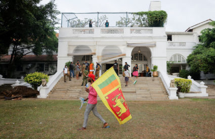 Demonstrators enter the Prime Minister's residence after Sri Lanka's President Rajapaksa fled, in Colombo