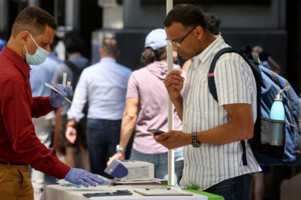 A woman takes a coronavirus disease (COVID-19) test at a pop-up testing site in New York