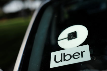 An Uber logo is shown on a rideshare vehicle during a statewide day of action to demand that ride-hailing companies Uber and Lyft follow California law and grant drivers "basic employee rights'', in Los Angeles, California, U.S., August 20, 2020. Photo by Mike Blake/REUTERS