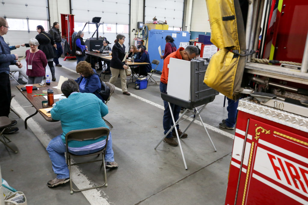 People vote in a firehouse for midterm elections in Meriden, Connecticut