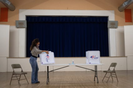 Presidio County election judge Lauren Martinez folds a booth after voting ended for the 2020 U.S. presidential election in Marfa, Texas, U.S., November 3, 2020. Photo by Adrees Latif/REUTERS