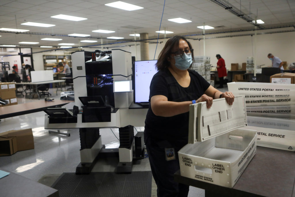 Election workers count ballots at the Maricopa County Tabulation and Election Center (MCTEC), in Phoenix, Arizona