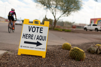 A sign points voters to a voting center for the Democratic primary in Sun City, Arizona, U.S., March 17, 2020. Photo by Cheney Orr/REUTERS