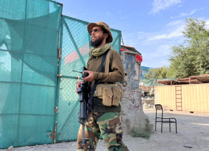 A Taliban fighter stands guard near the site where Al Qaeda leader Ayman al-Zawahiri was killed in a U.S. strike over the ...