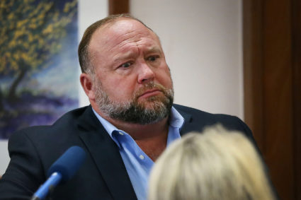 Alex Jones attempts to answer questions about his emails asked by Mark Bankston, lawyer for Neil Heslin and Scarlett Lewis, during trial at the Travis County Courthouse, Austin, Texas, U.S., August 3, 2022. Photo by Briana Sanchez/Pool via REUTERS