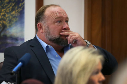 Alex Jones attempts to answer questions about his text messages asked by Mark Bankston, lawyer for Neil Heslin and Scarlett Lewis, during trial at the Travis County Courthouse , Austin, Texas, U.S., August 3, 2022. Photo by Briana Sanchez/Pool via REUTERS