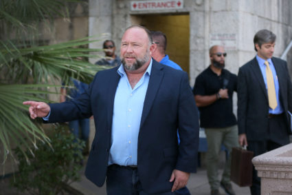 Alex Jones steps outside of the Travis County Courthouse, to do interviews with media after he was questioned under oath about text messages and emails by lawyer Mark Bankston, in Austin, Texas, U.S. August 3, 2022. Photo by Briana Sanchez/Pool via REUTERS