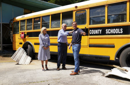 U.S. President Joe Biden pats Kentucky Gov. Andy Beshear as he and first lady Jill Biden visit a site where a bus was swept by floodwaters into a building in Lost Creek, Kentucky, U.S., August 8, 2022. Photo by Kevin Lamarque/REUTERS
