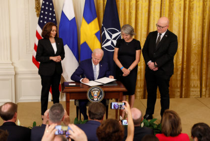 U.S. President Joe Biden, alongside Vice President Kamala Harris, Swedish ambassador to the U.S. Karin Olofsdotter and Finnish ambassador to the U.S. Mikko Hautala, signs documents endorsing Finland's and Sweden's accession to NATO, in the East Room of the White House, in Washington, U.S., August 9, 2022. Photo by Evelyn Hockstein/REUTERS