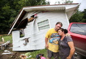 Reggie Ritchie comforts wife Della after Kentucky flooding