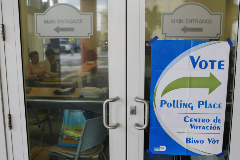 A polling center sign is seen outside Miami-Dade Public Library Hispanic Branch, at Little Havana neighborhood, during the...