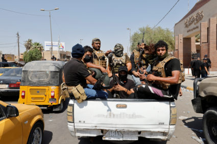 Followers of Iraqi cleric Moqtada al-Sadr withdraw from the streets after violent clashes, near the Green Zone in Baghdad