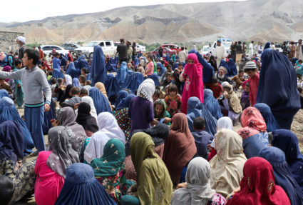 FILE PHOTO: Displaced Afghan families spend time together after the heavy flood in the Khushi district of Logar