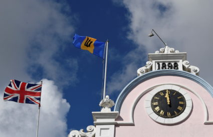The British Union flag and the national flag of Barbados fly next to each other on a building as preparations take place to mark the Caribbean island's transition to a republic, in Bridgetown, Barbados, November 29, 2021. Photo by Toby Melville/REUTERS