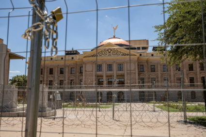 Fencing including razor wire forms a barrier to the Arizona state Capitol complex after it was installed following protests against the United States Supreme Court after it overturned the landmark Roe v Wade abortion decision, in Phoenix, Arizona, U.S. June 27, 2022. Photo by Caitlin O’Hara/REUTERS