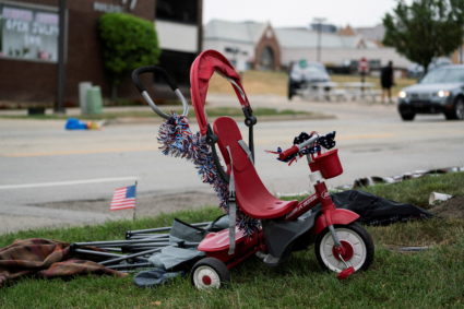 A tricycle is seen near the scene of a mass shooting at a Fourth of July parade route, in the Chicago suburb of Highland Park, Illinois, U.S. July 4, 2022. Photo by Max Herman/REUTERS