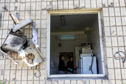 Svitlana Dmtrieva inspects her office and her department destroyed by a strike in Mykolaiv