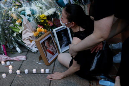A woman cries as she pays tribute to Britain's Queen Elizabeth II outside the British Consulate-General in Hong Kong, after death of Queen Elizabeth II at age 96. September 12, 2022. REUTERS/Tyrone Siu