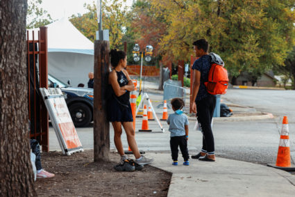 Migrants wait outside the City of San Antonio Migrant Resource Center, where two planeloads of mostly Venezuelan migrants sent via Florida to Martha’s Vineyard in Massachusetts had originated, in San Antonio, Texas, U.S. September 16, 2022. Photo by Jordan Vonderhaar/REUTERS