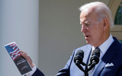 U.S. President Joe Biden looks at a pamphlet of the "12-Point Plan to Rescue America" from Republican U.S. Senator Rick Scott (R-FL) as the president speaks at an event about health care costs, Medicare and Social Security, in the Rose Garden of the White House in Washington, U.S., September 27, 2022. Photo by Jonathan Ernst/REUTERS