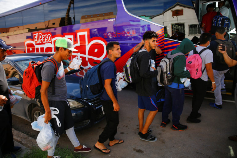 Migrants from Venezuela board a bus to New York after being released from U.S. border patrol custody in El Paso, Texas