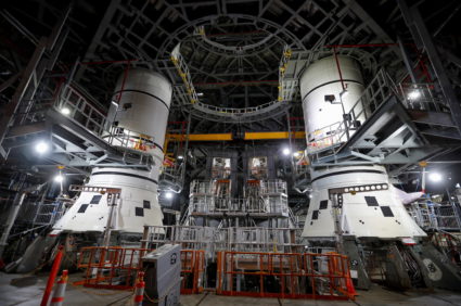 NASA's Artemis solid rocket boosters are shown inside the massive Vehicle Assembly Building at Kennedy Space Center