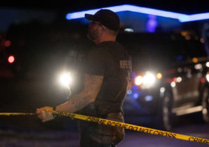 Memphis police officers work the scene where police arrested 19-year-old Ezekiel Kelly