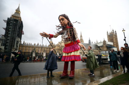 Giant refugee puppet "Little Amal" seen outside Houses of Parliament