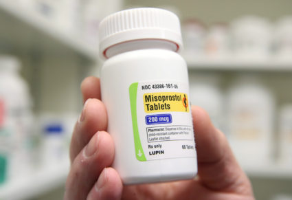 A pharmacist shows a bottle of the drug Misoprostol, made by Lupin Pharmaceuticals, at a pharmacy in Provo