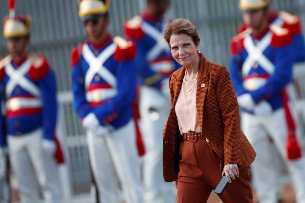 Brazil's Agriculture Minister Tereza Cristina walks before a national flag hoisting ceremony in front of Alvorada Palace i...