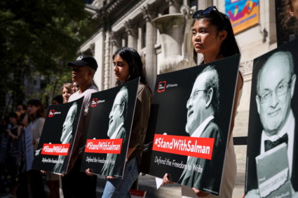 Supporters of author Salman Rushdie attend a reading and rally to show solidarity for free expression at the New York Publ...