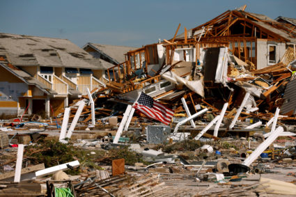 FILE PHOTO: An American flag flies amongst rubble left in the aftermath of Hurricane Michael in Mexico Beach