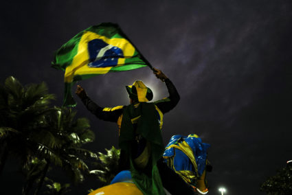 A supporter of Brazil's President Jair Bolsonaro reacts while gathering with fellow supporters outside Bolsonaro's home, in Rio de Janeiro, Brazil October 2, 2022. Photo by Lucas Landau/REUTERS