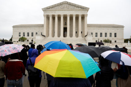 Environmental activists gather outside as the U.S. Supreme Court hears arguments in Sackett vs. EPA in Washington