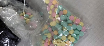 Muliticolor fentanyl pills in plastic bags, found by officers from the Drug Enforcement Administration, are pictured