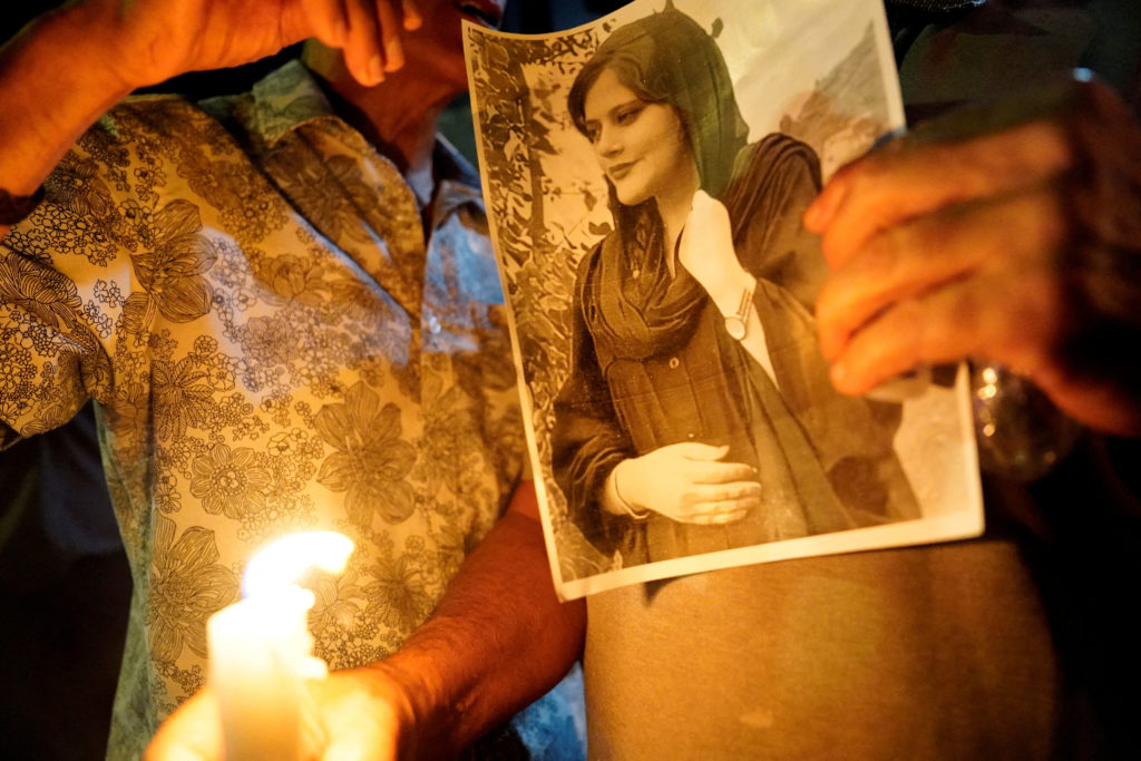 An image of Zhina Mahsa Amini at a candlelit vigil following her death, outside the Wilshire Federal Building in Los Angel...