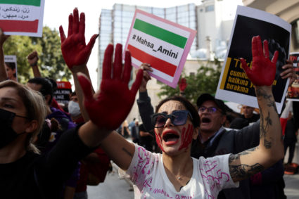 Demonstrators shout slogans during a protest against the Iranian regime, in Istanbul