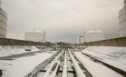 FILE PHOTO: Snow covered transfer lines leading to storage tanks at the Dominion Cove Point Liquefied Natural Gas (LNG) te...