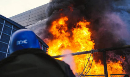 Firefighters work to put out a fire in a thermal power plant, damaged by a Russian missile strike in Kyiv