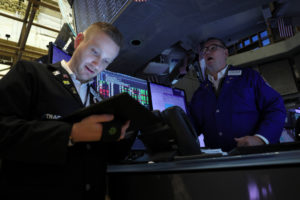 Traders work on the floor of the NYSE in New York