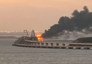 A view shows a fire on the Kerch bridge at sunrise in the Kerch Strait, Crimea