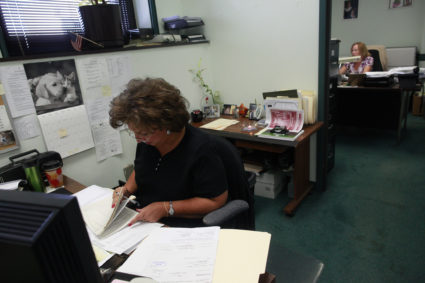 Workers sit at their desks in the City Controller's office at city hall in Scranton, Pennsylvania