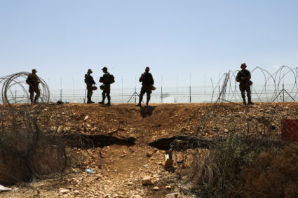 Israeli soldiers guard along a fence leading to the Israeli-occupied West Bank, as part of search efforts to capture six Palestinian men who had escaped from Gilboa prison earlier this week, by the village of Muqeibila in northern Israel September 9, 2021. Photo by Ammar Awad/REUTERS