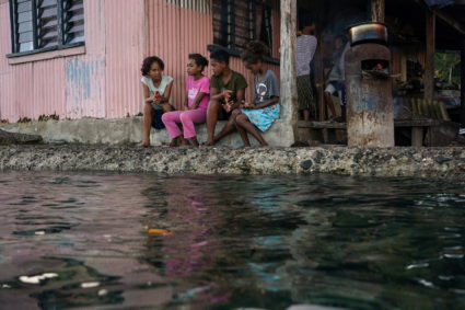 The Wider Image: Rising sea levels are forcing Fiji's villagers to relocate. They want polluters to pay instead