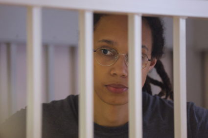 U.S. basketball player Brittney Griner, who was detained at Moscow's Sheremetyevo airport and later charged with illegal possession of cannabis, stands inside a defendants' cage during the reading of the court's verdict in Khimki outside Moscow, Russia August 4, 2022. Photo by Evgenia Novozhenina/Pool/REUTERS