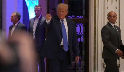 Former president Donald Trump greets supporters in the ballroom during an election watch party at Mar-a-Lago in Palm Beach...