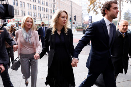 Theranos founder Elizabeth Holmes arrives with her family and partner Billy Evans to be sentenced on her convictions for defrauding investors in the blood testing startup at the federal courthouse in San Jose, California, U.S., November 18, 2022. Photo by Brittany Hosea-Small/REUTERS